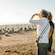 Two women standing next to each other near a gannet colony on a New Zealand beach